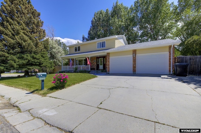 2203 W 42nd St, Casper, WY 82604 - traditional-style home with a garage, covered porch, concrete driveway, and brick siding