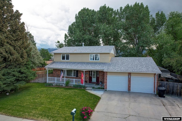 2203 W 42nd St, Casper, WY 82604 - traditional-style home with a porch, concrete driveway, brick siding, a garage, and a shingled roof