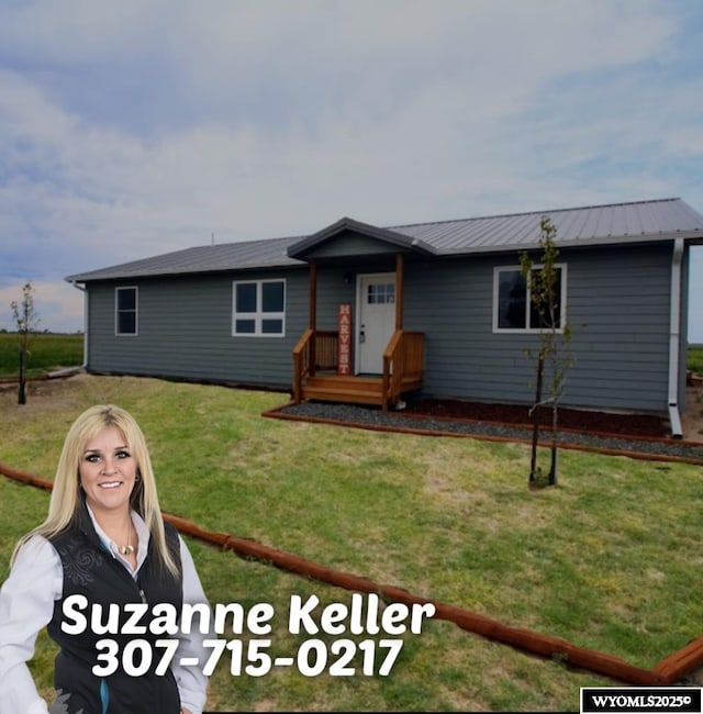 380 S-A Rd, Morrill, NE 69358 - ranch-style house with a front lawn and a metal roof