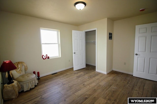 380 S-A Rd, Morrill, NE 69358 - unfurnished bedroom featuring wood-type flooring and a closet