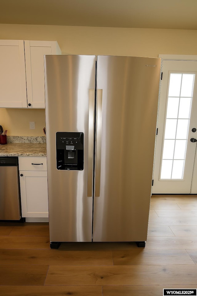 380 S-A Rd, Morrill, NE 69358 - kitchen with appliances with stainless steel finishes, light wood-type flooring, and white cabinetry
