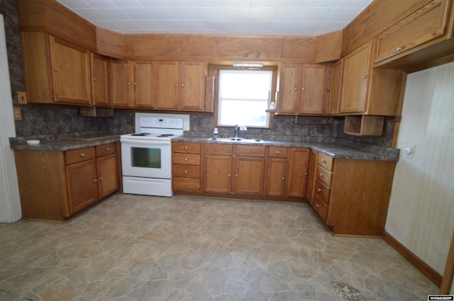 2142 W C St, Torrington, WY 82240 - kitchen featuring white electric range oven, brown cabinetry, decorative backsplash, and light stone finish floors