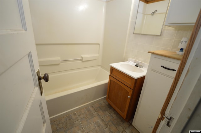 2142 W C St, Torrington, WY 82240 - bathroom with vanity, backsplash, and  shower combination