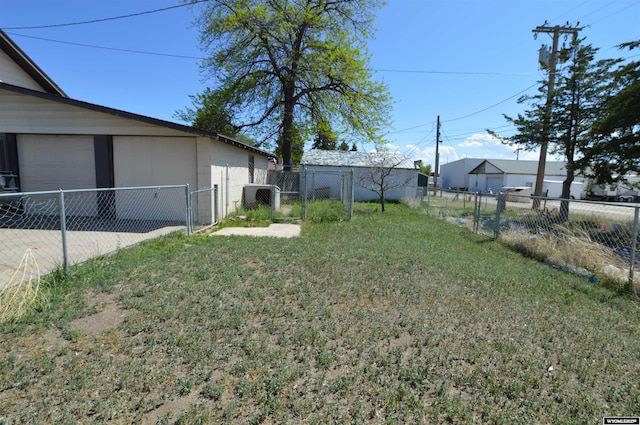 2142 W C St, Torrington, WY 82240 - fenced backyard featuring a gate and a garage