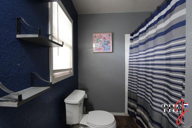 809 N Durbin, Casper, WY 82601 - full bath featuring wood finished floors, a shower with shower curtain, and a textured wall