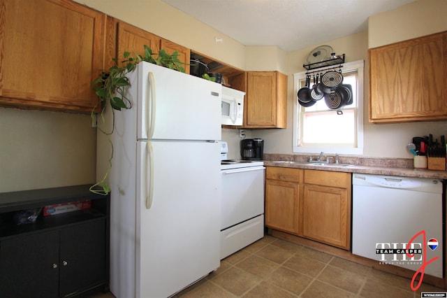 809 N Durbin, Casper, WY 82601 - kitchen with white appliances, light countertops, brown cabinets, and light tile patterned floors