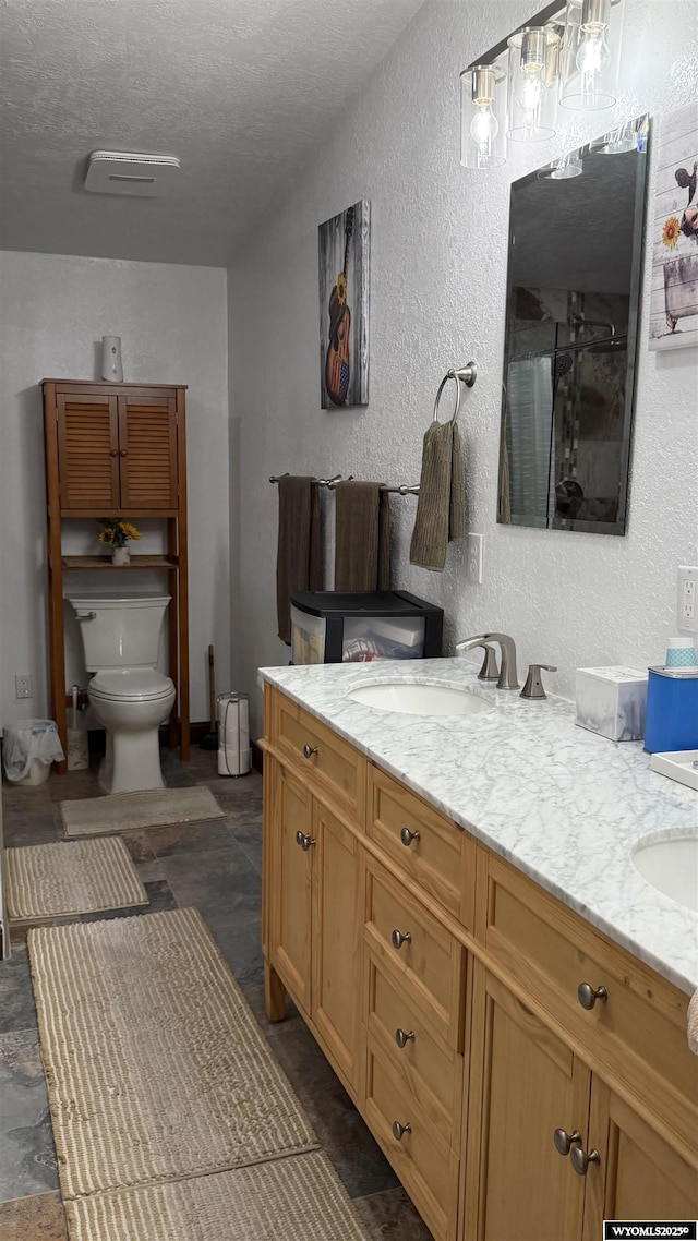 2108 Energy, Rawlins, WY 82301 - bathroom featuring a textured wall, double vanity, a textured ceiling, a shower, and a chandelier