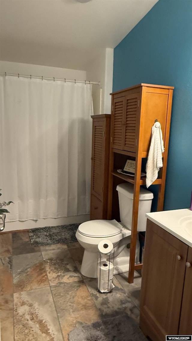 2108 Energy, Rawlins, WY 82301 - full bath featuring vanity, stone finish flooring, and shower / bath combo