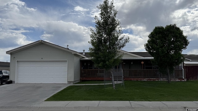 2108 Energy, Rawlins, WY 82301 - ranch-style home with concrete driveway, a front yard, covered porch, and an attached garage