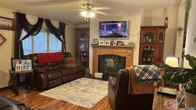 2108 Energy, Rawlins, WY 82301 - living area with a fireplace, wood finished floors, a ceiling fan, and lofted ceiling