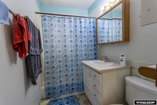 1220 Bon Ave, Casper, WY 82609 - full bath with vanity, shower / bath combination with curtain, and tile patterned flooring