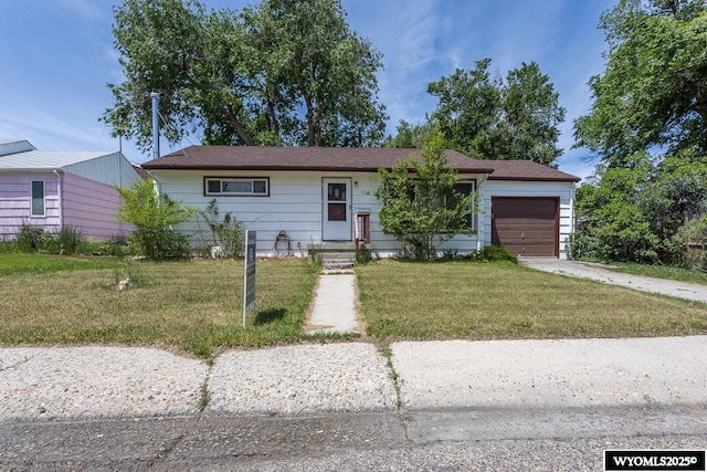 1220 Bon Ave, Casper, WY 82609 - ranch-style home with an attached garage, a front yard, and concrete driveway