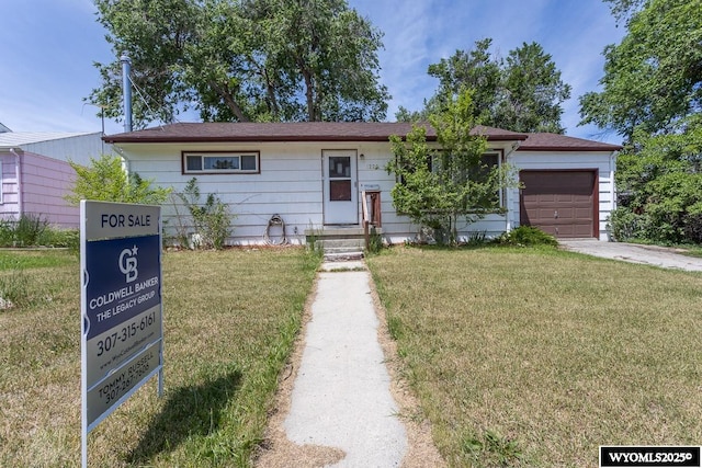 1220 Bon Ave, Casper, WY 82609 - ranch-style home with an attached garage, a front lawn, and driveway