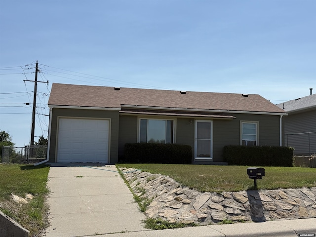 1903 Oakcrest, Casper, WY 82609 - ranch-style house with an attached garage, concrete driveway, and a shingled roof