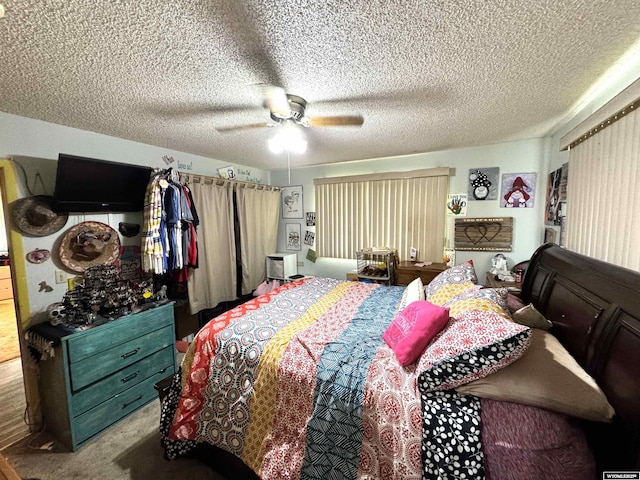 327 S Iowa Ave, Guernsey, WY 82214 - carpeted bedroom with a textured ceiling and ceiling fan