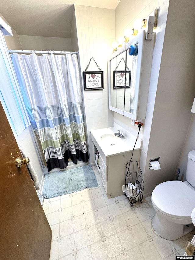 327 S Iowa Ave, Guernsey, WY 82214 - bathroom with tile patterned floors, vanity, and a shower with shower curtain