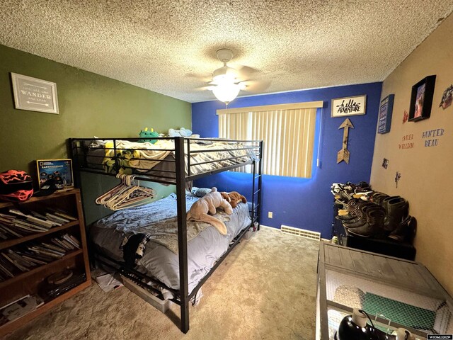 327 S Iowa Ave, Guernsey, WY 82214 - bedroom featuring carpet, a ceiling fan, and a textured ceiling