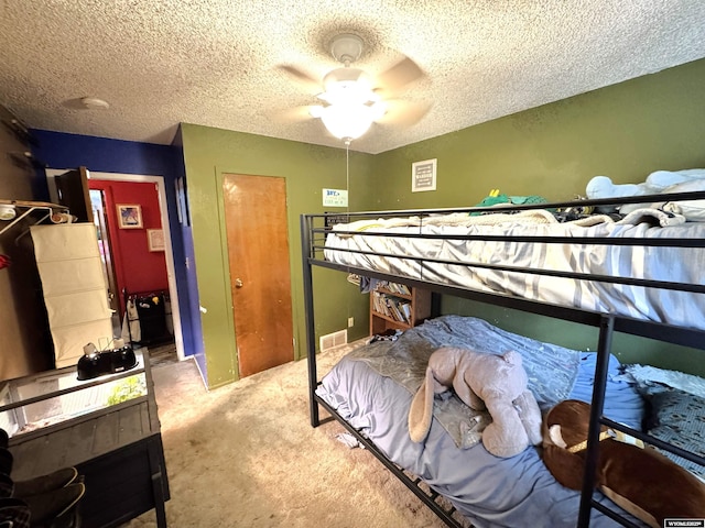 327 S Iowa Ave, Guernsey, WY 82214 - bedroom featuring a textured ceiling, carpet, and a ceiling fan