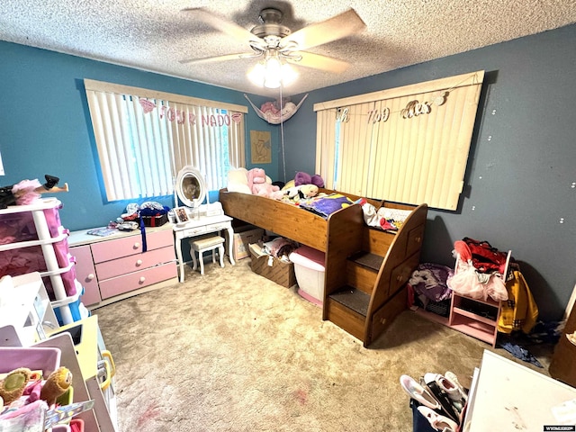 327 S Iowa Ave, Guernsey, WY 82214 - bedroom featuring carpet flooring, a textured ceiling, and a ceiling fan