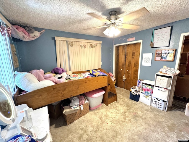 327 S Iowa Ave, Guernsey, WY 82214 - carpeted bedroom featuring a closet, ceiling fan, and a textured ceiling