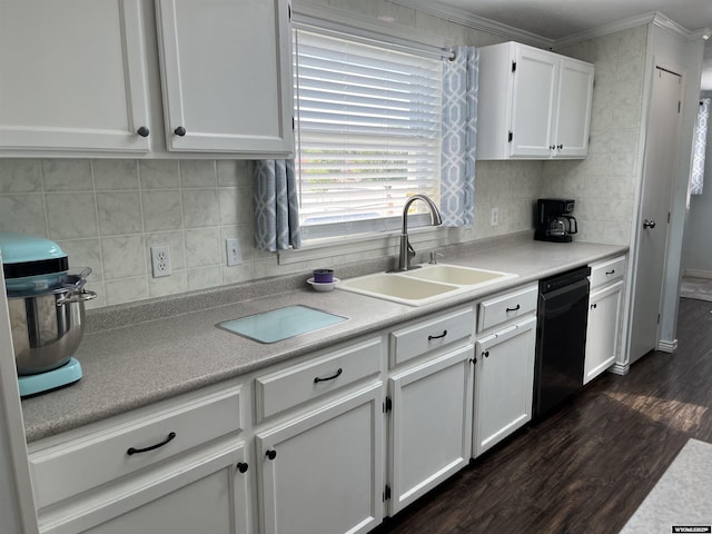 703 Randolph St, Rock Springs, WY 82901 - kitchen with black dishwasher, white cabinets, dark wood-style floors, decorative backsplash, and ornamental molding