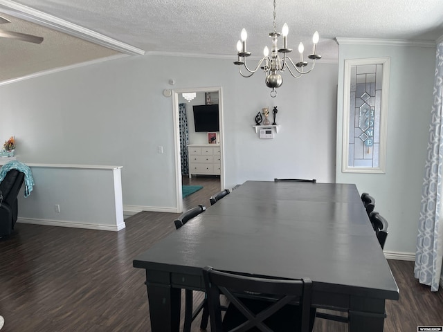703 Randolph St, Rock Springs, WY 82901 - dining room with a chandelier, dark wood-type flooring, a textured ceiling, crown molding, and lofted ceiling