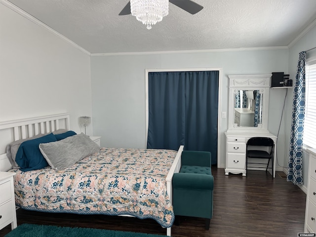 703 Randolph St, Rock Springs, WY 82901 - bedroom featuring dark wood-style flooring, ornamental molding, a ceiling fan, and a textured ceiling