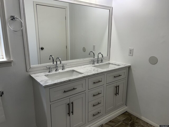 703 Randolph St, Rock Springs, WY 82901 - full bath featuring baseboards and double vanity