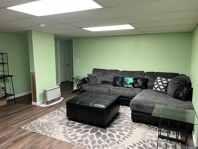 703 Randolph St, Rock Springs, WY 82901 - living room featuring wood finished floors and a paneled ceiling