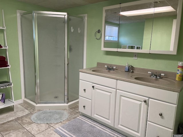 703 Randolph St, Rock Springs, WY 82901 - bathroom with double vanity, a shower stall, and tile patterned flooring