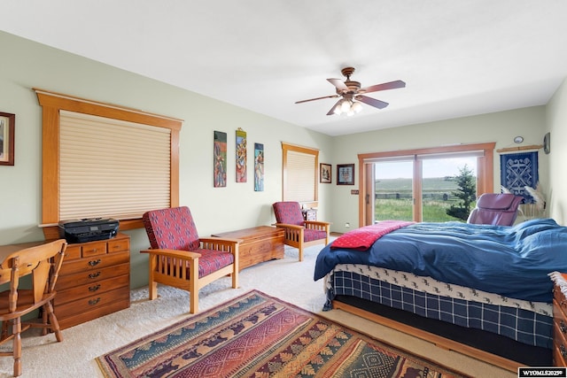 966 Mill Creek Rd, Evanston, WY 82930 - carpeted bedroom featuring access to exterior and a ceiling fan