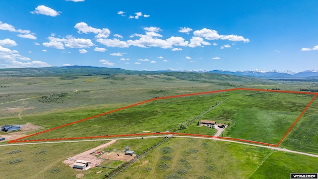 966 Mill Creek Rd, Evanston, WY 82930 - aerial view of sparsely populated area with property boundaries highlighted and a mountain backdrop
