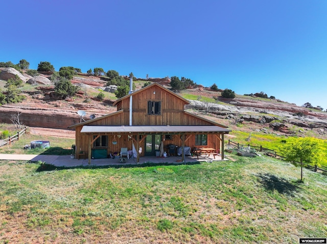 18 Lewis Dr, Lander, WY 82520 - back of property featuring a patio area