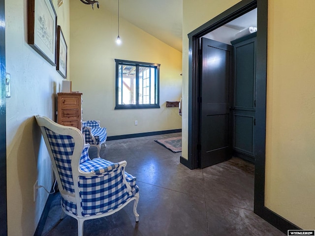 18 Lewis Dr, Lander, WY 82520 - living area featuring concrete floors and vaulted ceiling