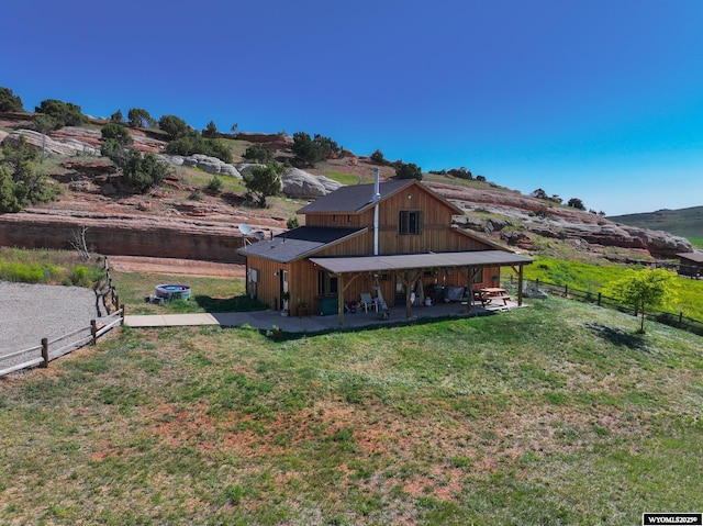 18 Lewis Dr, Lander, WY 82520 - back of property featuring a patio