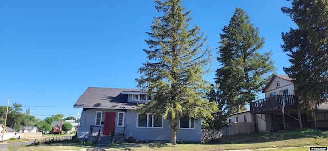 222 E Maple St, Rawlins, WY 82301 - view of front facade featuring a wooden deck