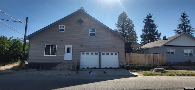 222 E Maple St, Rawlins, WY 82301 - view of property exterior featuring an attached garage