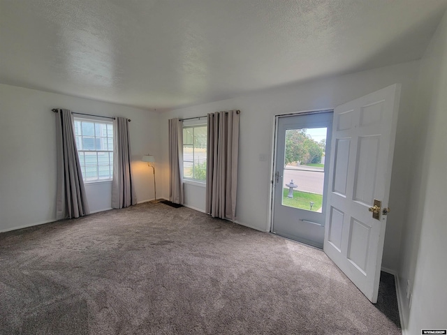 1031 Mckinley Ave, Rock Springs, WY 82901 - carpeted empty room featuring a textured ceiling