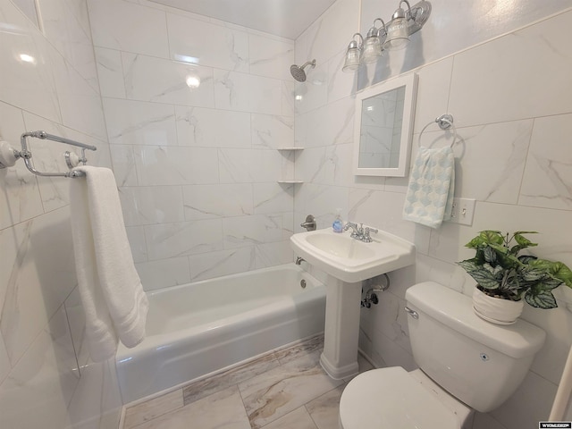 1031 Mckinley Ave, Rock Springs, WY 82901 - bathroom with shower / tub combination, tile walls, marble finish flooring, and decorative backsplash