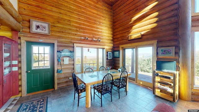 11 Heather Ln, Lander, WY 82520 - dining space featuring rustic walls and a high ceiling