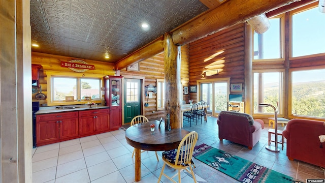 11 Heather Ln, Lander, WY 82520 - dining space with log walls, light tile patterned floors, and recessed lighting
