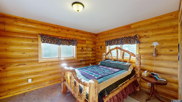 11 Heather Ln, Lander, WY 82520 - bedroom featuring multiple windows and rustic walls