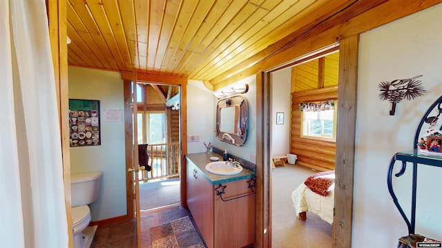 11 Heather Ln, Lander, WY 82520 - bathroom featuring vanity, wooden ceiling, stone finish floors, and ensuite bath