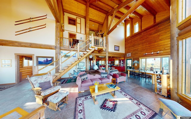 11 Heather Ln, Lander, WY 82520 - living area featuring a wood ceiling with exposed beams, plenty of natural light, stairs, and high vaulted ceiling