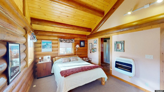 11 Heather Ln, Lander, WY 82520 - carpeted bedroom with heating unit, wooden ceiling, rustic walls, and a fireplace