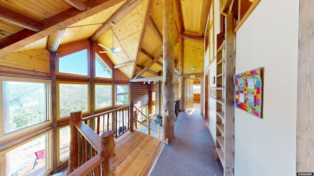 11 Heather Ln, Lander, WY 82520 - corridor with a wooden ceiling with exposed beams, plenty of natural light, high vaulted ceiling, carpet floors, and an upstairs landing