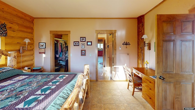 11 Heather Ln, Lander, WY 82520 - bedroom featuring rustic walls, a walk in closet, a desk, a closet, and ornamental molding