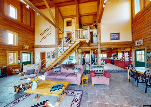 11 Heather Ln, Lander, WY 82520 - living area with high vaulted ceiling, stairs, and a wooden ceiling with exposed beams