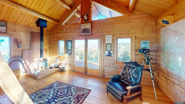 11 Heather Ln, Lander, WY 82520 - sitting room with wood walls, french doors, a wood stove, wood-type flooring, and wooden ceiling