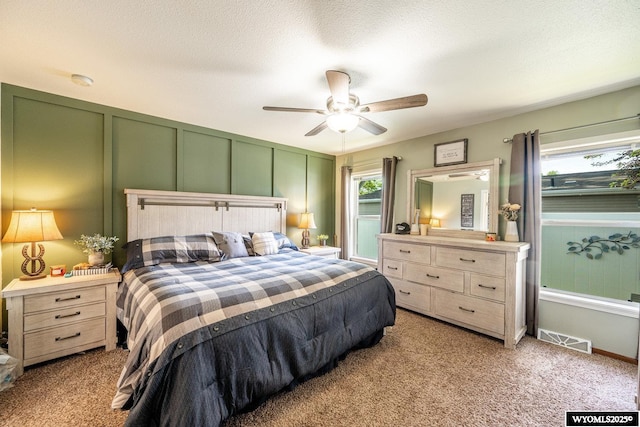 750 N Adams Ave, Buffalo, WY 82834 - carpeted bedroom with a decorative wall and ceiling fan